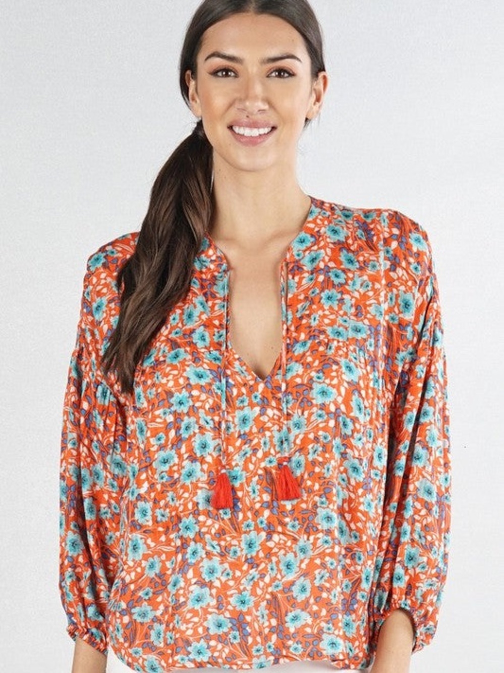 Orange Floral Blouse with Turquoise Accents